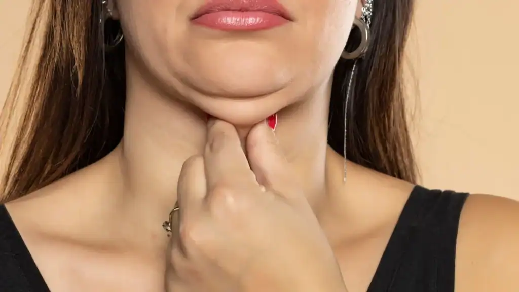 An image of a woman with double chin, sad, worried : Non Surgical Double Chin Removal Treatment in Harwich, UK